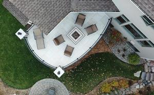 Overhead view of a paver patio with a built-in fire table