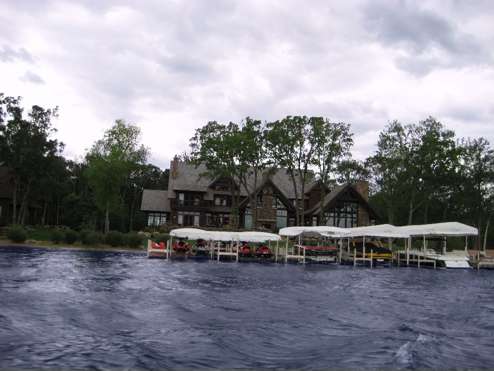 Lake Minnetonka home with covered boat slips along the shoreline