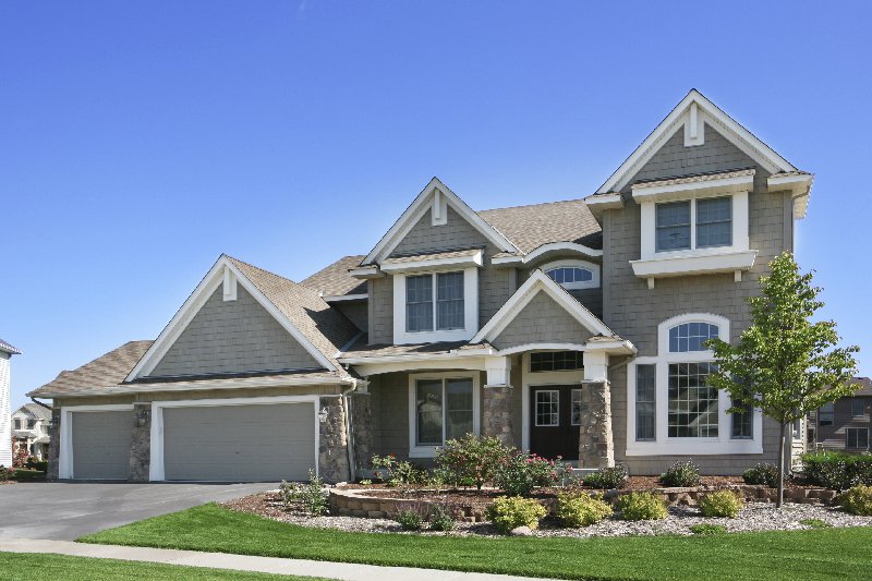 Two-story Minneapolis home with shake siding and stone