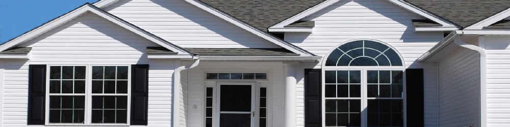 White home with new double-hung and arched windows