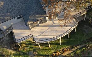 Overhead view of a large multi-angle deck wrapping a home