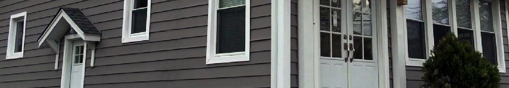 Gray lap siding with white trim