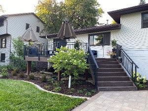 Deck and stair rebuild with landscaping at a hillside home