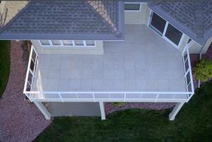 Overhead view of a covered porch and paver landing