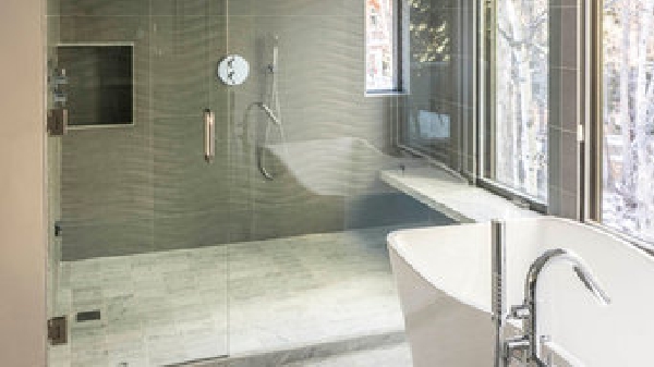 Master bath suite with tile shower and freestanding soaking tub