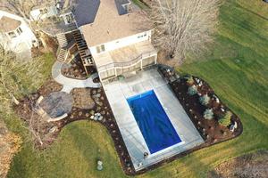 Backyard with pool, patio and stair access from the deck above